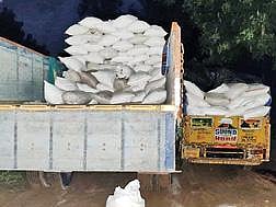 லாரியில் ஏற்றப்பட்ட ரேஷன் அரிசி மூட்டைகள்.