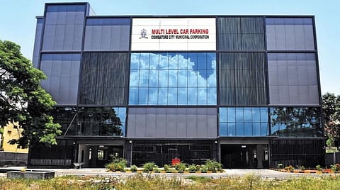 கோவை ஆர்.எஸ்.புரத்தில் பணிகள் முடிந்தும் மின் இணைப்பு தாமதத்தால் பயன்பாட்டுக்கு வராத பல அடுக்கு வாகன நிறுத்தகம்