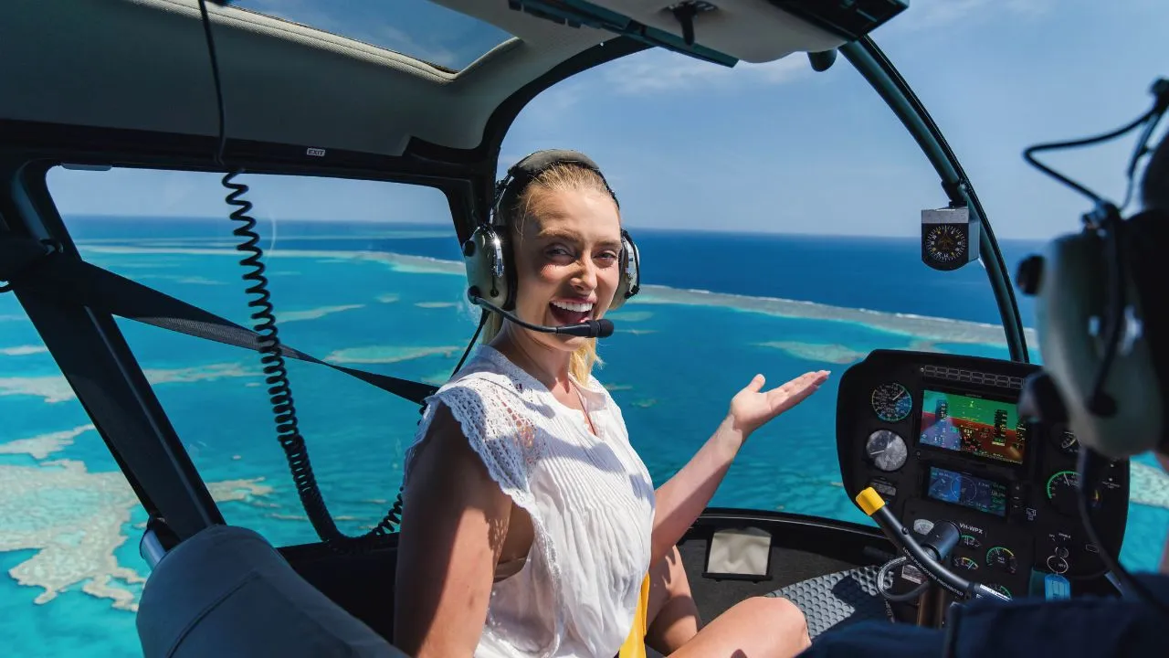 Grace Hayden takes in sweeping aerial views of the Heart Reef from a helicopter