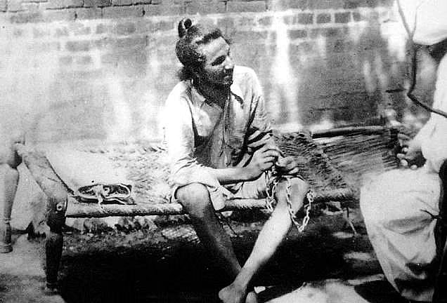 Bhagat Singh in handcuffs being interrogated by police during his first arrest and imprisonment at Railway Police Lockup at Lahore in May 1927.