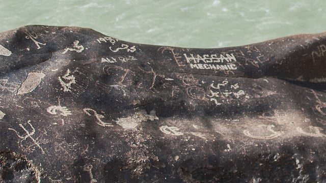 Indecipherable engarvings at Dha-Bema, along with an advertisement for Hassan Mechanic. Only one of those is pre-historic. 