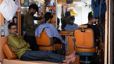 Over several months, Ranjit documented these humble spaces capturing what they’ve come to represent beyond a mere haircut