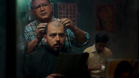 ‘Barber of the Gods’ uses a supernatural premise to examine generational conflict, inherited professions, and the burden of tradition, framing it as a critique of blind faith and the idea of sacredness.