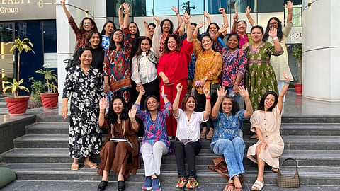 The women of 'Women On Wealth' pose for a group picture.