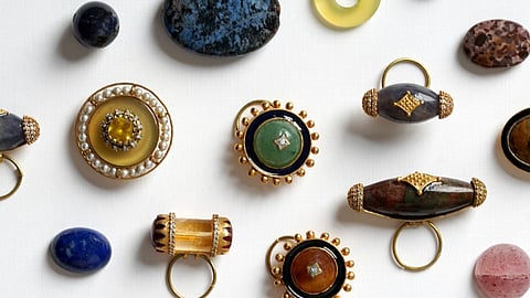 Handcrafted buttons and stone pieces created for the project.