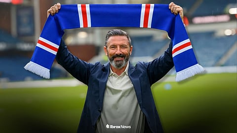 Derek McInnes holding a Rangers scarf at Ibrox