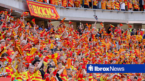 Fans of Jagiellonia Bialystok waving their scarves