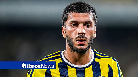 Oguz Aydin looking straight-faced forward while in action for Fenerbahce