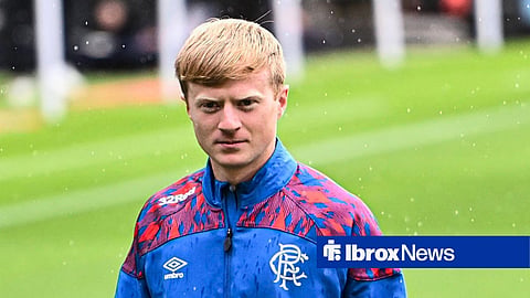 Lyall Cameron walking in a Rangers tracksuit
