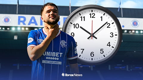 Nicolas Raskin in a Rangers kit at Ibrox with a clock beside him