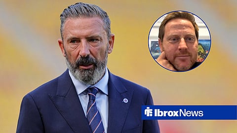Derek McInnes looking left in Rangers suit, with Michael Stewart looking on
