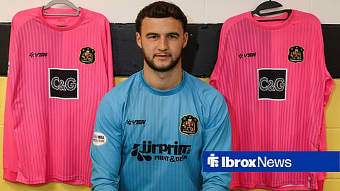 Rangers goalkeeper Mason Munn posing as a new Dumbarton player after completing loan move