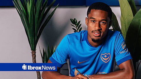 Ex-Rangers loanee Jayden Meghoma posing as he signs Portsmouth contract