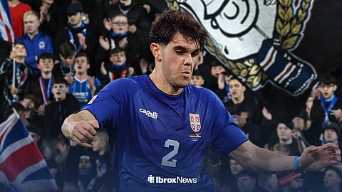 Rangers' Kosta Nedeljkovic in action for Serbia with Ibrox Stadium background