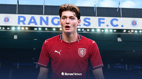 Ryan Naderi in a Czechia home kit, with Ibrox in the background