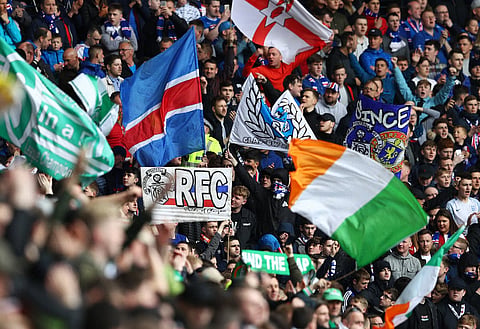 Rangers and Celtic fans watching their teams play