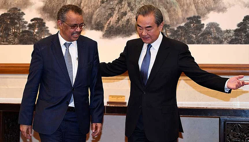 Tedros Adhanom, director-general of the World Health Organization with Chinese Foreign Minister Wang Yi in Beijing in January 2020. The WHO's slant towards China has been critiqued across the world.