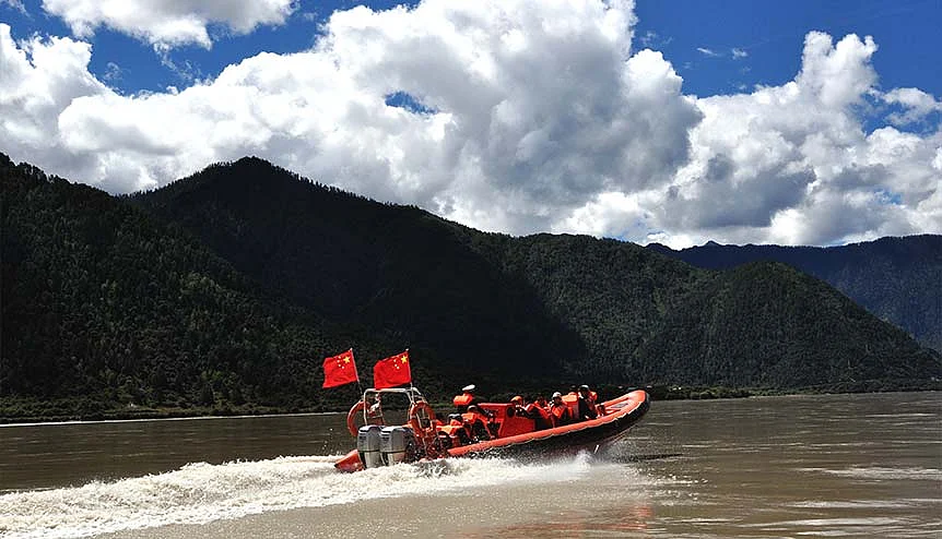 People travel on the Yarlung Zangbo river (also known as Brahmaputra river) by speedboat in Nyingchi, west Chinas Tibet Autonomous Region. China is planning a 60GW of hydro-electric project on Brahmaputra. Many security specialists aver that Chinese dam building in the upper reaches of the Brahmaputra can develop into yet another friction point for the two Asian giants.