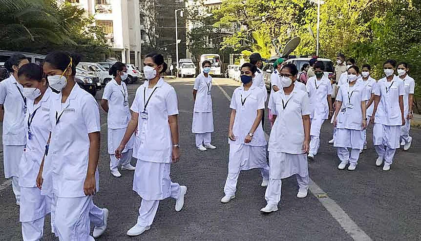 Frontline workers from Cooper Hospital in Mumbai prepare themselves for the first beneficiary of the Covid-19 vaccine. The rollout among 1.3 billion people is no ordinary assignment.