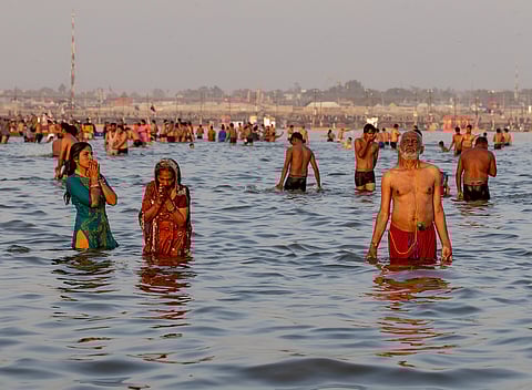 Pilgrims taking a dip at the confluence of the Sangam.