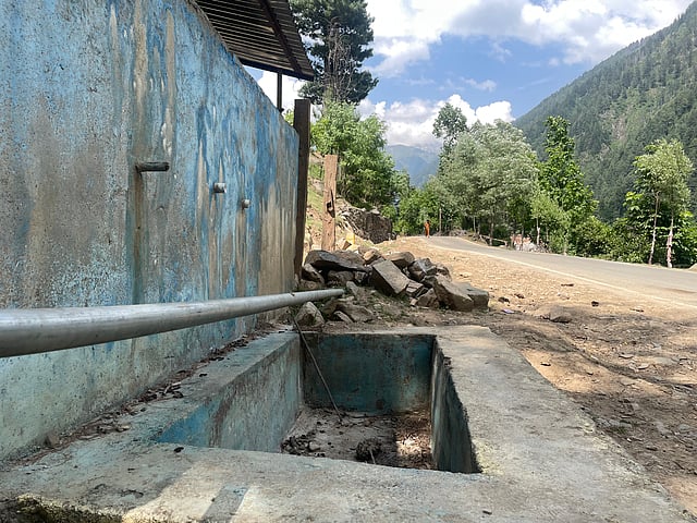 A dry water trough in Naranag, where six natural springs once flowed. Only one remains today.