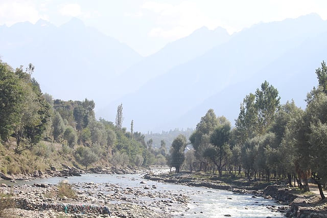 Sand mining has changed the Sindh River in Hari Ganwan. Miners stripped away sand and gravel, leaving the river flowing low through a wide, shallow bed.