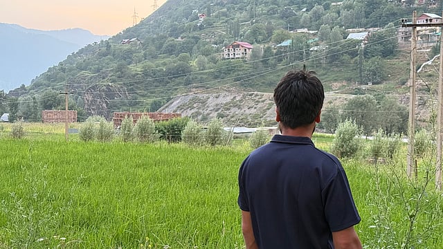 “The land is still there, but the farming is gone. With no irrigation or support, I can’t depend on this land anymore,” says Hilal Ganie as he looks at his field.