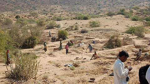Constructing check dams under MGNREGA. (Source: IWP Flickr Photos)