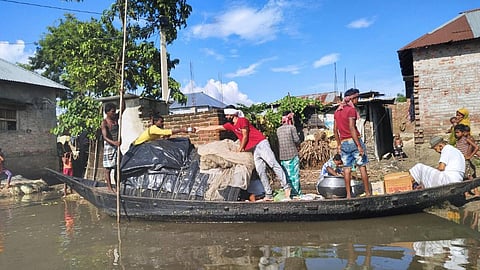 Locals provide aid to people hit by floods in Bihar