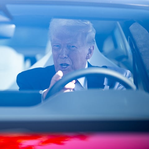 Donald Trump in a Tesla on the South Lawn of the White House.