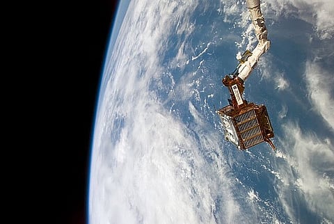 S77-E-5065 - Spartan 207 free-flyer held by Space Shuttle Endeavour RMS on May 21, 1996