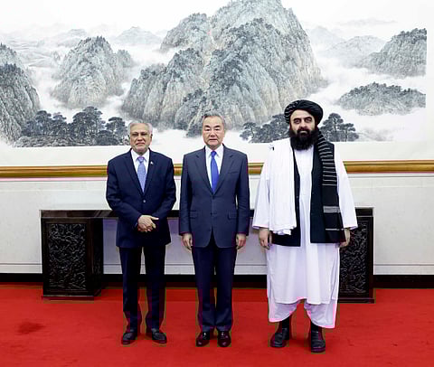 Pakistani Foreign Minister Mohammad Ishaq Dar, Chinese Foreign Minister Wang Yi and Afghan Acting Foreign Minister Amir Khan Muttaqi 
