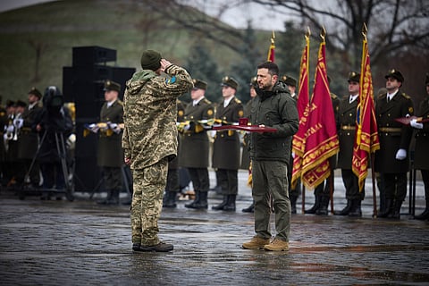 Ukrainian President Volodymyr Zelensky presents a soldier with an award