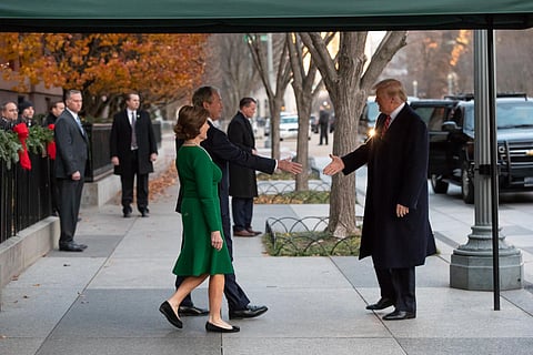 U.S. President Donald Trump greets former President George W. Bush, 2018.