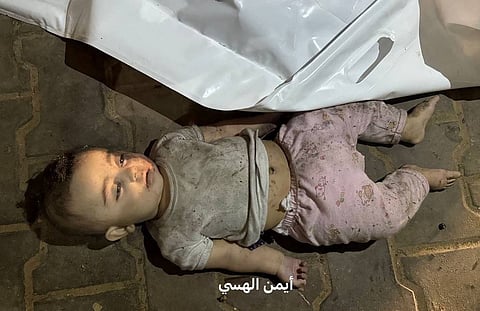 A Palestinian child killed in the Israeli strike that hit a residential apartment in central Gaza City.
