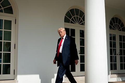 Donald J Trump Walking beside the White House