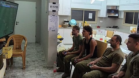 Israeli soldiers occupying and playing games at a displaced Palestinian family’s home in Tulkarm, West Bank.