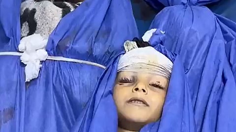 A child, among others, killed by an Israeli airstrike on residential homes targeted  in Al-Nuseirat.