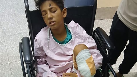A 13-year-old boy, Rakan, who survived an Israeli airstrike in Gaza that killed his entire family. His injuries include a leg amputation and severe eye damage requiring urgent retinal surgery.