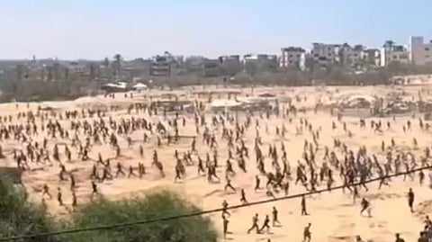Starving Palestinians seeking aid from airdrops.