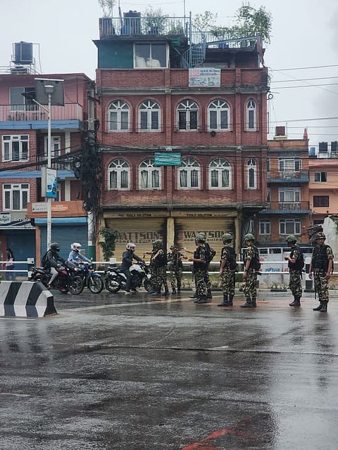 Nepali Army soldiers conducting strict ID checks in Kathmandu amid a nationwide curfew, following violent Gen Z protests.