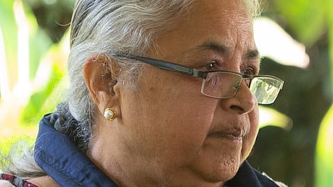 Nepal's former Chief Justice Sushila Karki speaks with a staff member of the US Embassy at the Summit for Democracy, 2021.