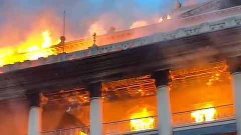 Nepal's parliament building engulfed in flames on 9 September 2025, symbolizing the collapse of governmental authority amid widespread anti-corruption protests.