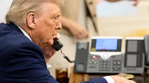 President Donald Trump speaks with Russian President Vladimir Putin on the phone, Monday, August 18, 2025, in the Oval Office.