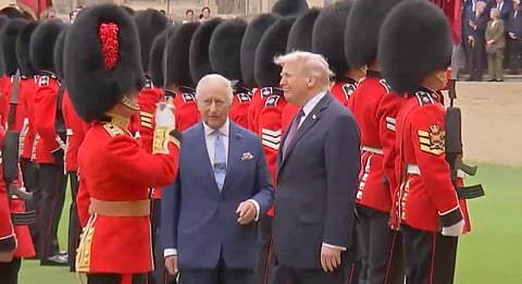 President Trump and King Charles observe a ceremonial Guard of Honour in the Quadrangle.