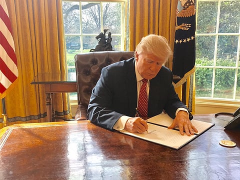 U.S. President Donald Trump signing an Executive Order, 2017. 