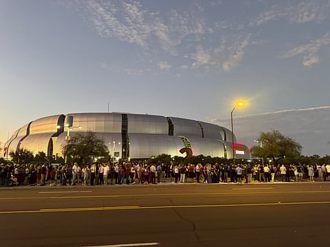 A large crowd gathered outside State Farm Stadium in Glendale, Arizona, hours before Kirk's memorial service.