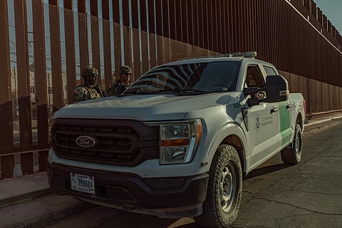 Soldiers from the 401st Military Police Company, 720th Military Police Battalion, Joint Task Force–Southern Border, meet with a U.S. Customs and Border Protection officer.