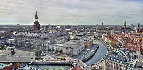 Christiansborg Palace and Chapel on Slotsholmen in Copenhagen, Denmark, seen from the top of St. Nicolas' Church.