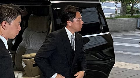 Shinjiro Koizumi, Agriculture Minister and son of former Prime Minister Junichiro Koizumi, enters the Ministry of Agriculture, Forestry and Fisheries headquarters on May 21, 2025.